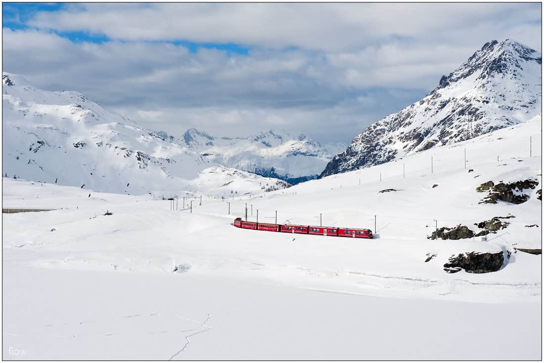 On top of Bernina pass in the winter. Lago Bianco is fully covered by ice and snow.