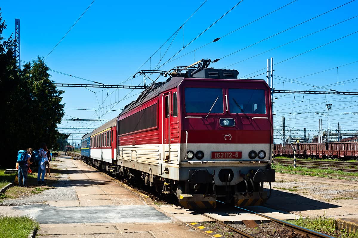 The one-car regional train across the border to Chop with the Prague - Lviv through sleeping car at the station of Cierna nad Tisou.