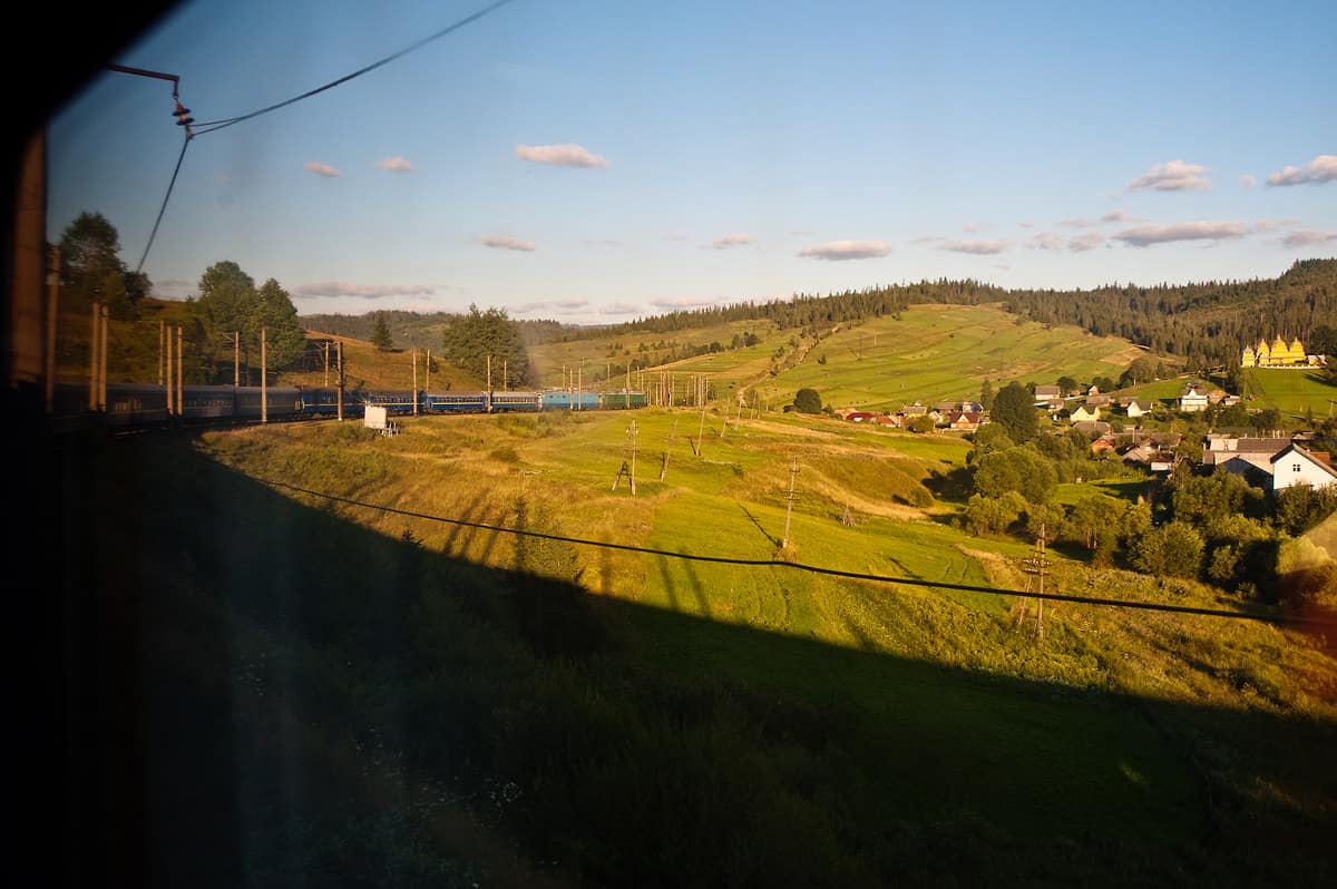 The long train descends from the summit towards Lviv.